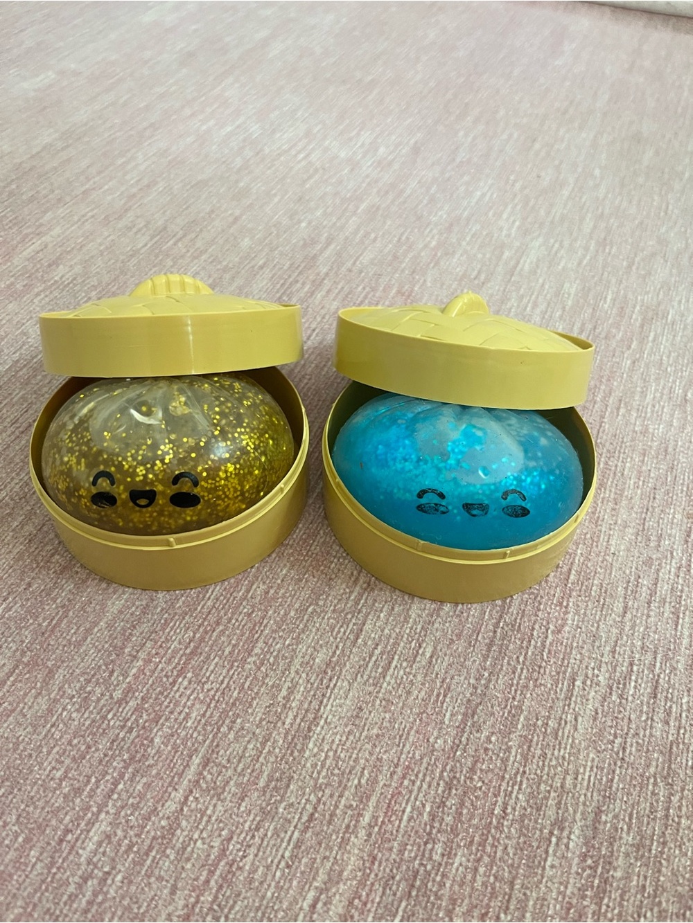Two glitter dumpling squishes.